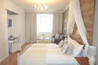 A bed or beds in a room at Villa Bucher - Metnitztalerhof