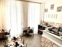 A kitchen or kitchenette at Hotel Alessander