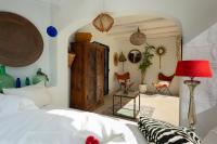 A bed or beds in a room at Caballito de Mar Boutique Hotel