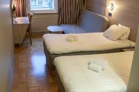 Postel nebo postele na pokoji v ubytování Hotell Stinsen