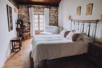 Postel nebo postele na pokoji v ubytování Casa de Santa Uxía