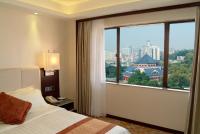 Guangdong Hotel-Free Shuttle & Registration Counter Service during Canton Fairにあるベッド