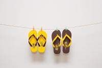 three pairs of shoes hanging on a clothesline at amba Taipei Ximending in Taipei