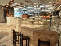 A restaurant or other place to eat at Villa Gogo offers privacy and pool