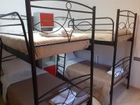 A bed or beds in a room at Villa Gogo offers privacy and pool