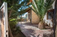 A garden outside Villa Gogo offers privacy and pool