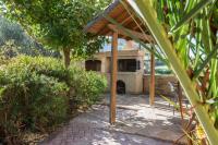 A garden outside Villa Gogo offers privacy and pool