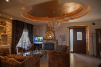 A television and/or entertainment centre at Villa Gogo offers privacy and pool
