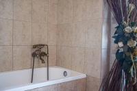 A bathroom at Villa Gogo offers privacy and pool