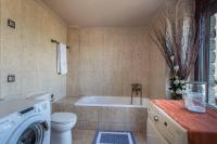 A bathroom at Villa Gogo offers privacy and pool