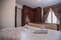 A bed or beds in a room at Villa Gogo offers privacy and pool