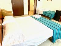 A bed or beds in a room at Hotel Alessander