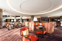 a lobby of a hotel with chairs and tables at Crowne Plaza Vientiane by IHG in Vientiane