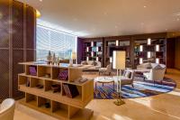 a living room with a table and chairs at Crowne Plaza Vientiane by IHG in Vientiane