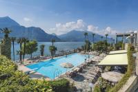 a swimming pool with a view of the water and mountains at Residence L&#39;Ulivo in Bellagio