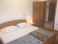 Łóżko lub łóżka w pokoju w obiekcie Apartments Maleo