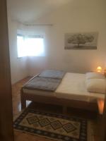 Łóżko lub łóżka w pokoju w obiekcie Apartments Maleo