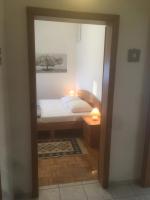 Łóżko lub łóżka w pokoju w obiekcie Apartments Maleo