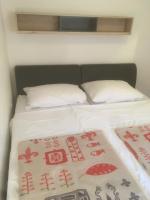 Łóżko lub łóżka w pokoju w obiekcie Apartments Maleo