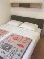 Łóżko lub łóżka w pokoju w obiekcie Apartments Maleo