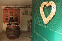 a room with a heart hanging on a wall at Buchschneider - Ferienhaus Maier - Landhof in Schwarzautal