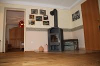 a living room with a fireplace in a room at Buchschneider - Ferienhaus Maier - Landhof in Schwarzautal