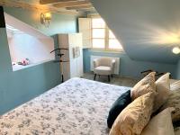 Postel nebo postele na pokoji v ubytování Akla Suites con Jacuzzi Santillana