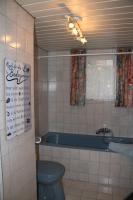 a bathroom with a blue toilet and a bath tub at Buchschneider - Ferienhaus Maier - Landhof in Schwarzautal