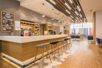 a bar in a restaurant with stools at Holiday Inn Express - Yerevan by IHG in Yerevan