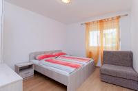 Posteľ alebo postele v izbe v ubytovaní Apartments Pela