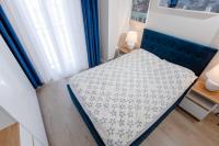 Posteľ alebo postele v izbe v ubytovaní Resort Apartamenty Klifowa Rewal 32