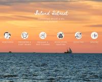 a sunset over the ocean with a sail boat at Sarikantang Resort & Spa, Koh Phangan in Haad Rin
