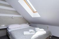 Ein Bett oder Betten in einem Zimmer der Unterkunft Willa Arielka