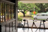 a table and two chairs in front of a window at Talmud Hotel Taichung in Taichung