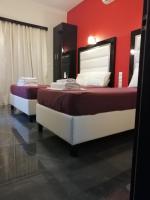 Posteľ alebo postele v izbe v ubytovaní Spiros Rooms