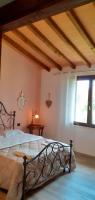Posteľ alebo postele v izbe v ubytovaní Agriturismo Le Chiare Stelle