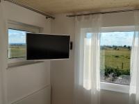 Televízia a/alebo spoločenská miestnosť v ubytovaní Zimmerei - Landgasthaus Karlo