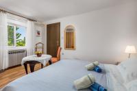 Posteľ alebo postele v izbe v ubytovaní Apartments & Rooms Ribarić