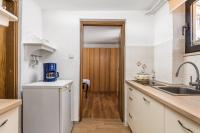Kuchyňa alebo kuchynka v ubytovaní Apartments & Rooms Ribarić