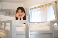 Ein Bett oder Betten in einem Zimmer der Unterkunft Noursabah Boutique Bed Bangkok
