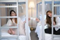 Ein Bett oder Betten in einem Zimmer der Unterkunft Noursabah Boutique Bed Bangkok
