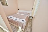 Posteľ alebo postele v izbe v ubytovaní Panoráma City Apartman