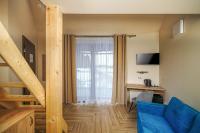 TV a/nebo společenská místnost v ubytování Hotel Dymník