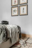 a bedroom with three framed pictures on the wall at Aries Hotel & SPA Wisła in Wisła
