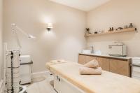 a hospital room with two beds and a kitchen at Aries Hotel & SPA Wisła in Wisła