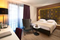 Posteľ alebo postele v izbe v ubytovaní Amphora Hotel