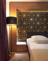 Posteľ alebo postele v izbe v ubytovaní Amphora Hotel