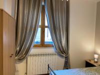 Łóżko lub łóżka w pokoju w obiekcie La Casa al Bacio