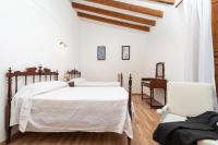 A bed or beds in a room at Sa Plana Nova