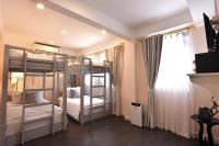 Ein Bett oder Betten in einem Zimmer der Unterkunft Noursabah Boutique Bed Bangkok